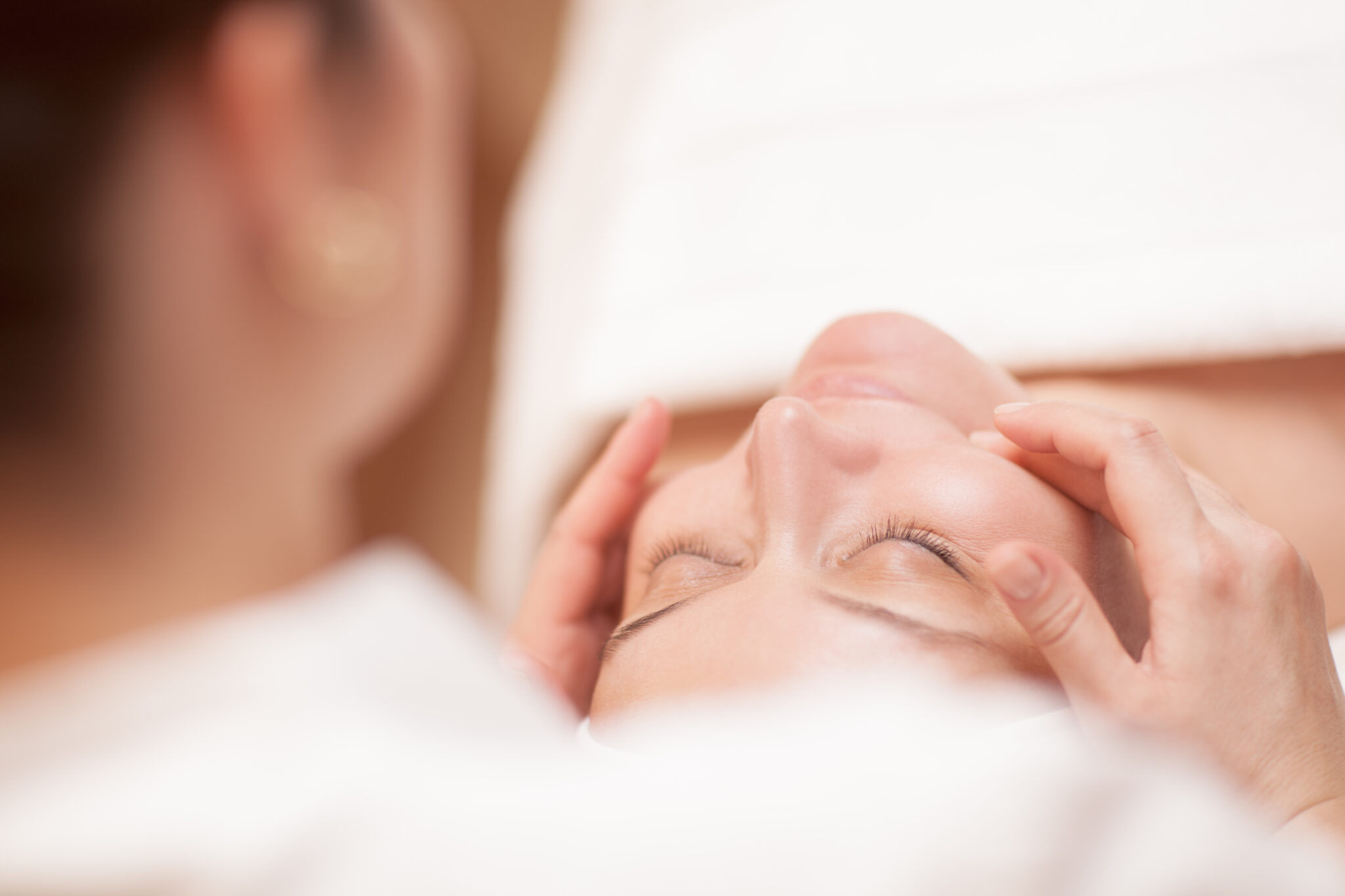 Woman getting professional facial massage Facials in Virginia Beach, woman getting professional facial massage cool body sculpting center shore drive virginia beach hampton roads 757